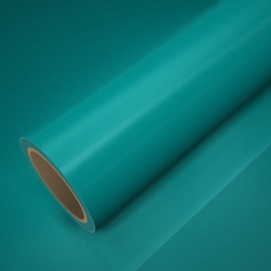 Rouleau de vinyle ICR® vert émeraude posé sur une feuille du même vinyle