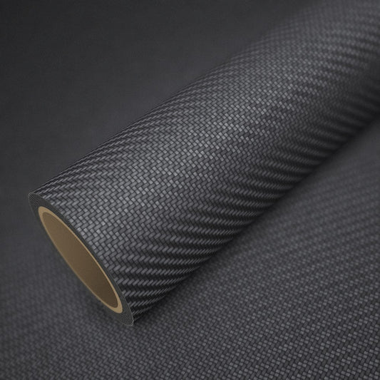 Rouleau de vinyle carbone noir mat Premium posé sur une feuille du même vinyle