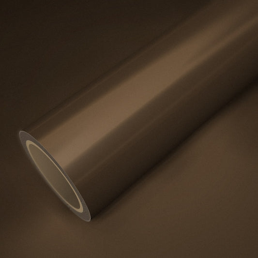 Rouleau de vinyle chrome satiné terre posé sur une feuille du même vinyle